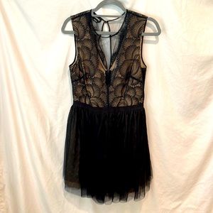 Bebe dress. Black with nude lining. Worn once to wedding. Size 8.